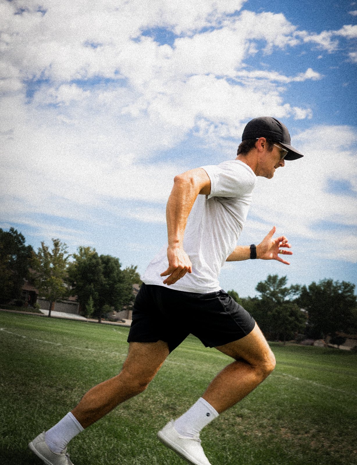 Connor running on grass, mid stride